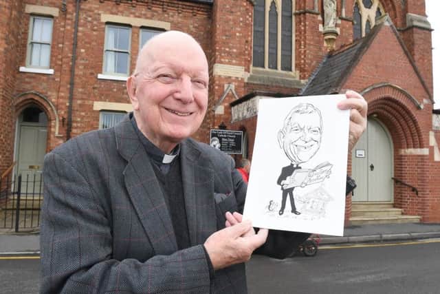 Father Michael Bell leaving Sleaford's Our Lady of Good Councel. Pictured with his caricature that was in the Sleaford Standard.