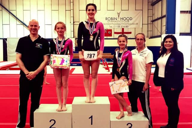 From left, coach Edward Shields, Chloe King, Evie Ballaam, Erin Maxwell, coach Nicola James, judge and head coach Patsy Shields EMN-170806-160418002