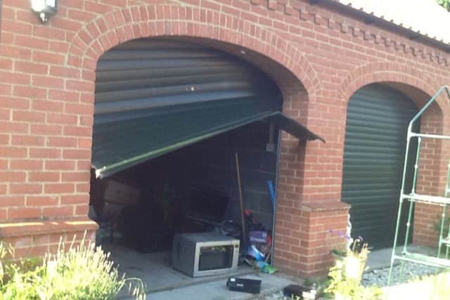 The damage to Mrs Weir's garage door is 'devastating'.