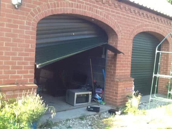 The damage to Mrs Weir's garage door is 'devastating'.