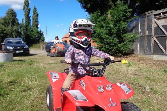 The red Quadzilla Buzz is a favourite toy of Duncan's (7). Photo supplied.