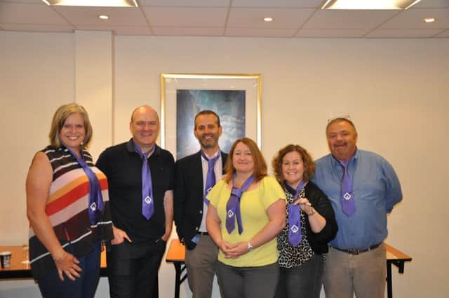 Longhurst Group's executive team after taking on the Purple Tie Challenge