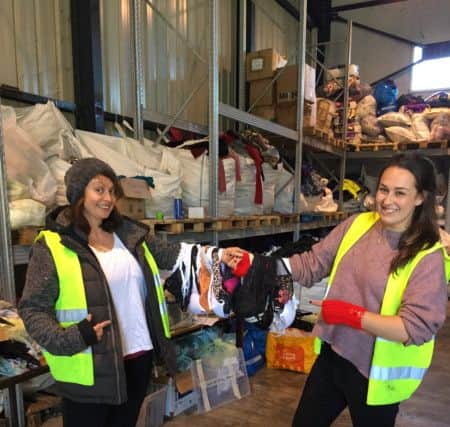 Nicky Hammond, left, at the distribution centre EMN-171206-093319001