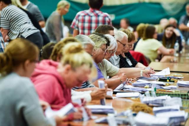 The final votes being counted, minutes before the result was announced. Photo: John Aron.