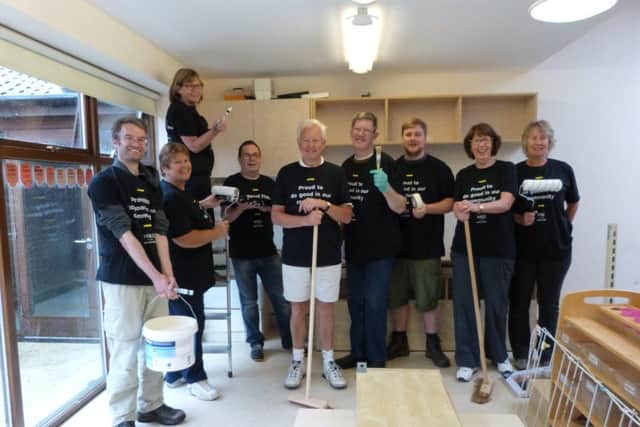 Volunteers from M&S: Emerson Bartlett, Pip Brown, on the steps Sue Elliott, Andy Briggs, Director of Rock Foundation Paul Brown, Gary Bruwer, Matt Wooffindin, Geraldene Richardson-Eames and Lynne Philips. (Lin) EMN-170619-095759001