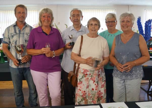 Some of the trophy winners at this years Sweet Pea and early Summer Flower Show in Middle Rasen Village Hall EMN-170621-070909001