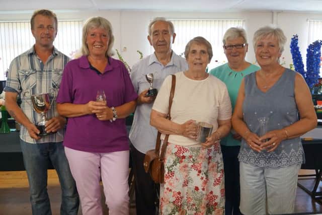 Some of the trophy winners at this years Sweet Pea and early Summer Flower Show in Middle Rasen Village Hall EMN-170621-070909001