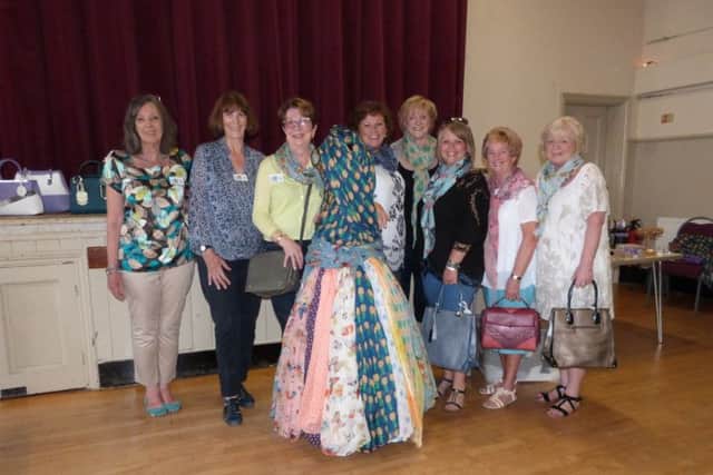 A lovely line-up: Andrea Clarke (Programme Secretary), Sacha Emmett (Press Officer), WI President Rachel Grainger, Flossie the Mannequin, Helen Robinson, Sue Wesley, Trudi Douglas, Audrey Parkinson andMargaret Duncan. (Lin) EMN-170506-143843001