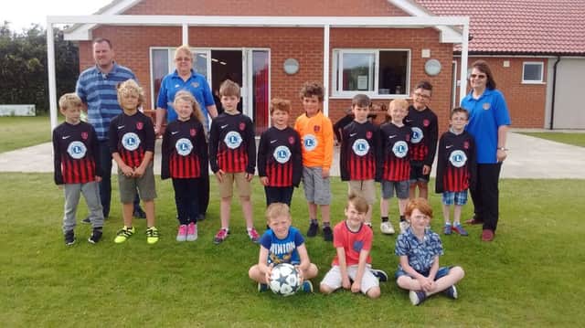 Coningsby and Tattershll Lions visited Woodhall Spa FC Club to present the youth team with new football shirts. EMN-170621-073334001