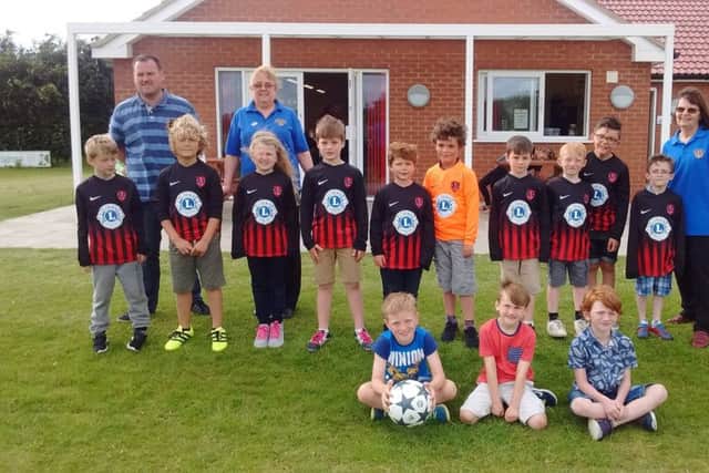 Coningsby and Tattershll Lions visited Woodhall Spa FC Club to present the youth team with new football shirts. EMN-170621-073334001