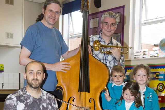 Some of the musicians from Sinfonia Viva, pictured with Foundation Stage 2 pupils.