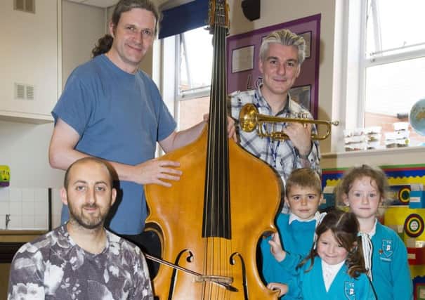 Some of the musicians from Sinfonia Viva, pictured with Foundation Stage 2 pupils.