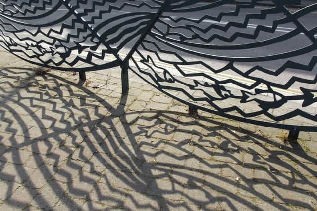 Shadow of the Wyvern railings by Lucy Hubbert, in the Monument Gardens on Southgate. EMN-170616-094152001