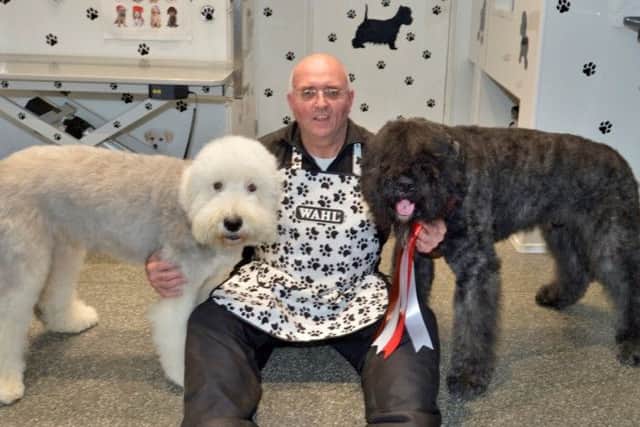 Adrian Long and just two of his prize winning dogs. Pictured is Lexi (left) and Bozley his most recent winner (right).