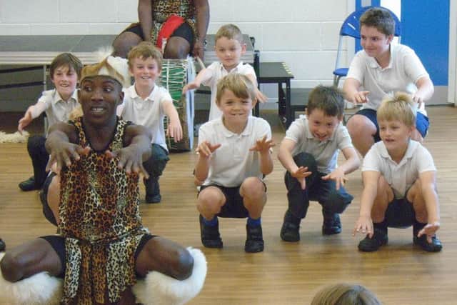 Pupils pictured with the Mighty Zulu Nation Theatre Company. EMN-170626-105705001