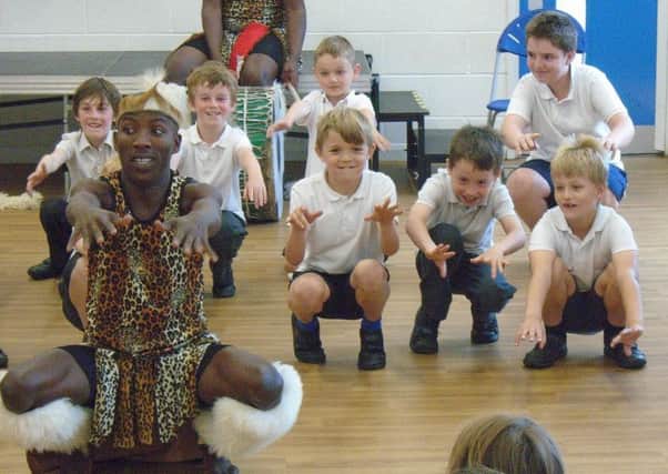 Pupils pictured with the Mighty Zulu Nation Theatre Company. EMN-170626-105705001