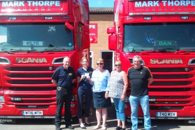 Drivers4Defibs present their fundraising efforts to LIVES. EMN-170622-175707001