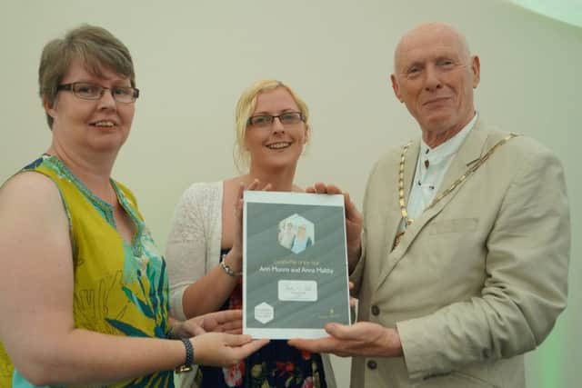 Lincolnshire County Council Vice Chairman Ron Oxby presenting a Good Citizens Award to friends Ann Munro and Anna Maltby of Sleaford. ANL-170622-092145001