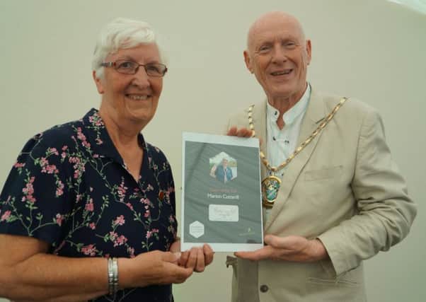 Lincolnshire County Council  Vice Chairman Ron Oxby presenting a Good Citizens Award to Marion Cotterrill, of Skegness. ANL-170622-092213001