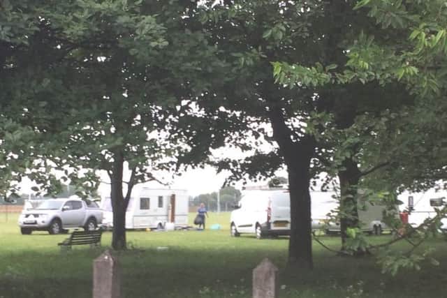 Travellers clearing up after a police operation where two stolen caravans were seized from a site in Skegness.