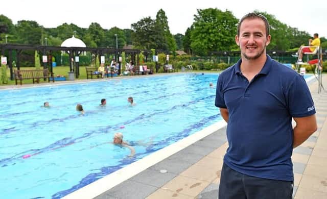 Th e heat is on: Jubilee Park manager Joe Stanhope with the outdoor pool in the background. Photo: John Aron