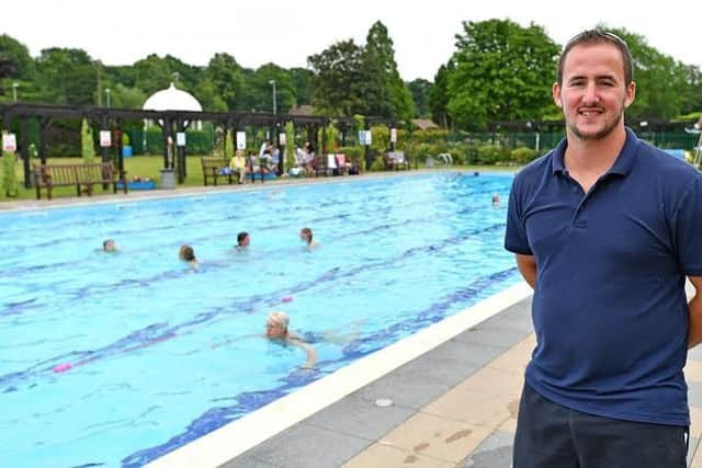 Th e heat is on: Jubilee Park manager Joe Stanhope with the outdoor pool in the background. Photo: John Aron