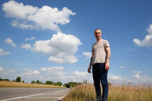 Colin Self in the long grass at the A17 junction with Boston Road, Heckington which he claims obscured his view, leading to a potentially serious crash. EMN-170619-141229001