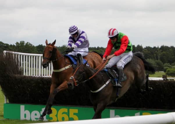 Sean Bowen (left) on Earthmoves, is well placed to win as the leaders jump the final fence in the DFDS Summer Plate Trial Handicap Steeplechase EMN-170626-102831002