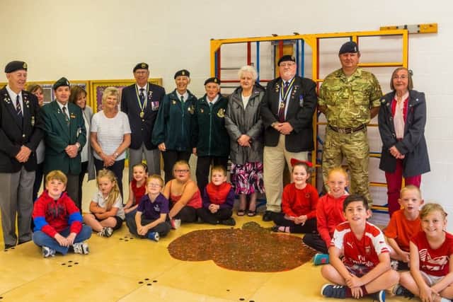 Members of the Mablethorpe Royal British Legion with pupils at Mablethorpe Primary Academy.