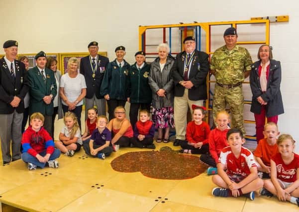 Members of the Mablethorpe Royal British Legion with pupils at Mablethorpe Primary Academy.
