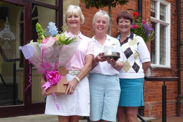 Swan Trophy sponsior Di Everitt (left) with winner Allison Cook and lady captain Andrea Smaggasgale (right) EMN-170626-152222002
