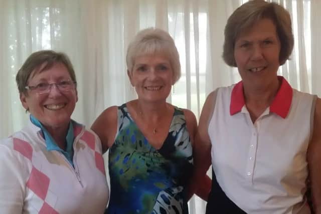 Winners Eileen Ballard and Carol Lake flank lady captain Fliss Smith EMN-170626-155432002
