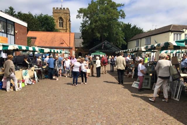 Shoppers out and about in the Market Place for the Bric-a-brac event.