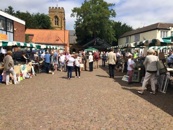 Shoppers out and about in the Market Place for the Bric-a-brac event.