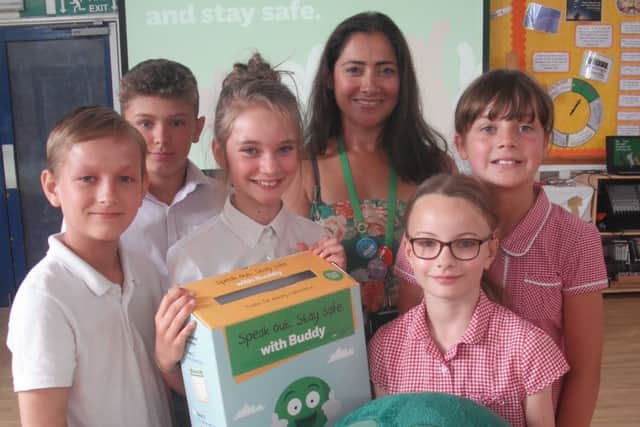 Pupils pictured with school mascot Buddy. EMN-170407-143854001