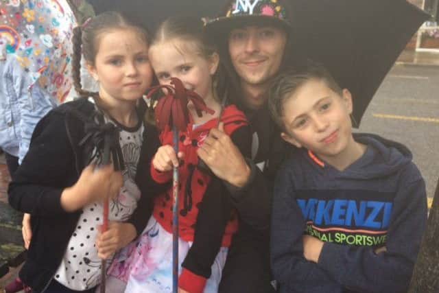 The Bates family from Spilsby Micheala, 7, Faith 5, dad Antony and Antony Jnr, 9 y enjoying the fun at the SO Festival. ANL-170628-115435001