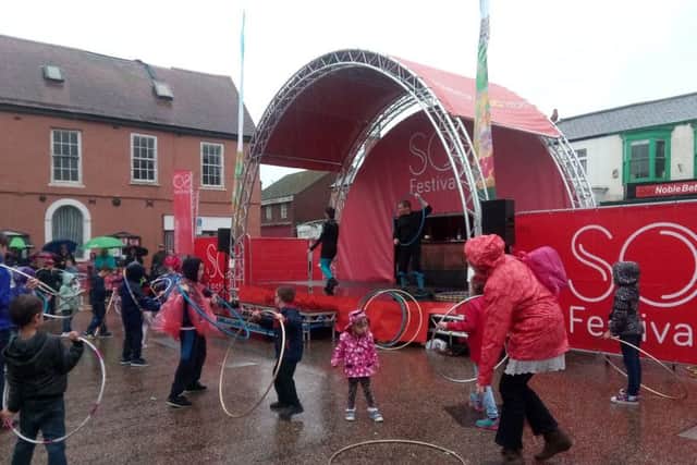 Children learning circus skills with Flame Oz at the Launch of the SO Festival in Spilsby. ANL-170628-122725001