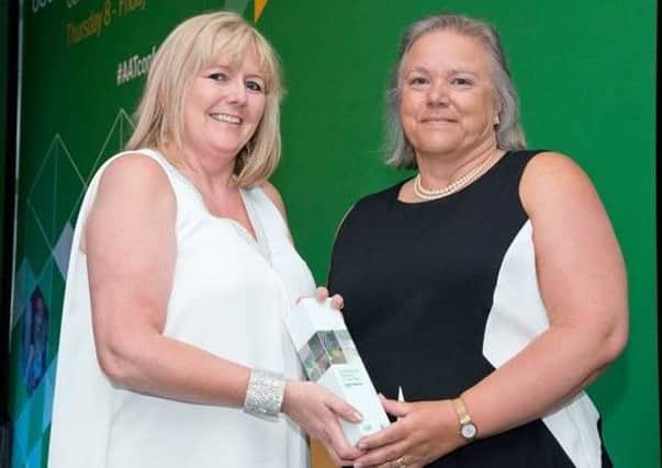 Hazel Copeland (right) receives her award EMN-170628-232114001