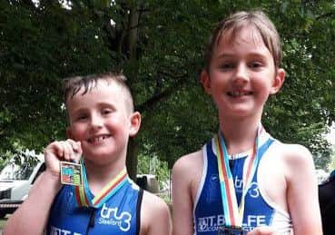 Ted Bentley and Ollie Higgins after their first-ever triathlons EMN-170629-172856002