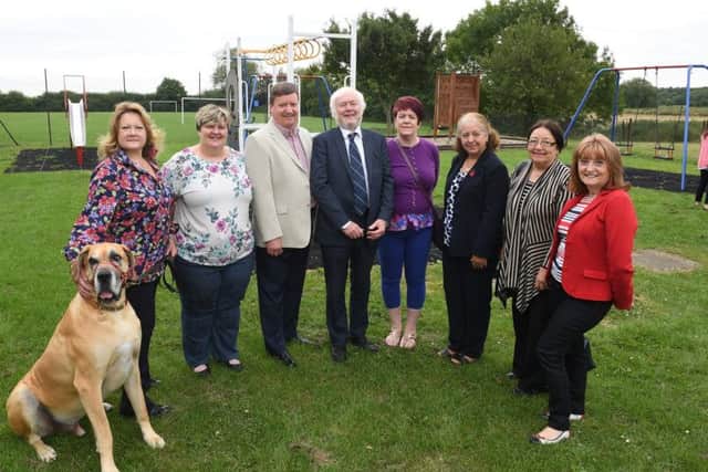 Refurbished play park at Anwick Community Centre, officially opened by Cllr Julia Harrison. L-R Julia Harrison with her dog Roman, Dianne Gardiner - parish councillor, Terry Curtis - chairman of parish council, Nigel Hunt - sponsor, Elaine Hammett - parich councillor, Lorraine Curtis - parish councillor, Sally Hunt and Jeanne Flanagan - clerk to parish council. EMN-170407-125554001
