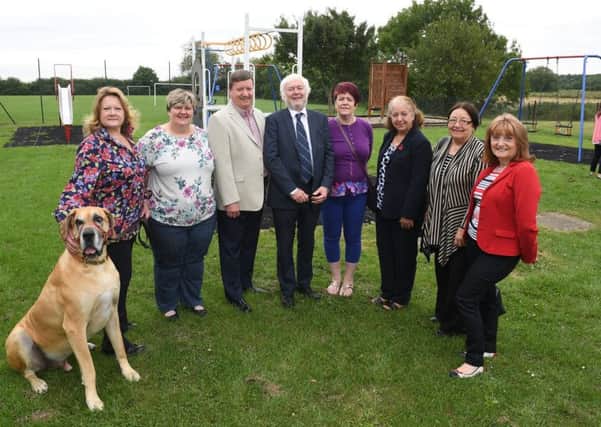 Refurbished play park at Anwick Community Centre, officially opened by Cllr Julia Harrison. L-R Julia Harrison with her dog Roman, Dianne Gardiner - parish councillor, Terry Curtis - chairman of parish council, Nigel Hunt - sponsor, Elaine Hammett - parich councillor, Lorraine Curtis - parish councillor, Sally Hunt and Jeanne Flanagan - clerk to parish council. EMN-170407-125554001