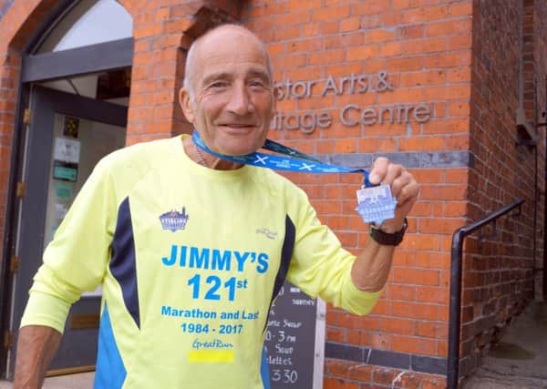 Jimmy Dutch with the medal for completing his 121st - and final - marathon EMN-171007-151518001