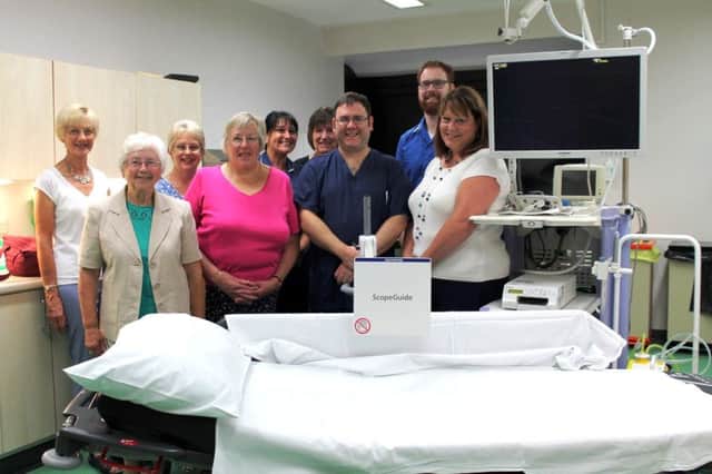 The new endoscopy machine at Louth hospital, alongside fundraisers and hospital staff.