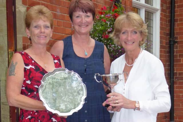 Kenwick Park ladies' champion Anne Wright (left) holds the Founders Salver with lady captain Andrea Smaggasgale, and nett winner Freda Cooper (right) EMN-170707-130254002