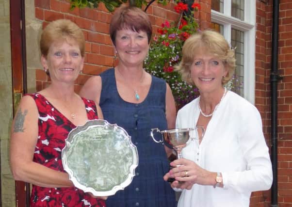 Kenwick Park ladies' champion Anne Wright (left) holds the Founders Salver with lady captain Andrea Smaggasgale, and nett winner Freda Cooper (right) EMN-170707-130254002