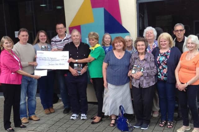 A cheque presentation to Lincolnshire and Nottinghamshire Air Ambulance following successful sales of a book of poems and stories. EMN-170717-162820001