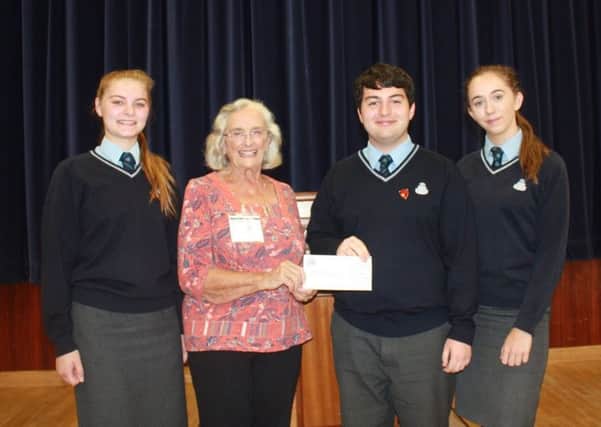 Students presented the cheque to Mrs Pat Wright.