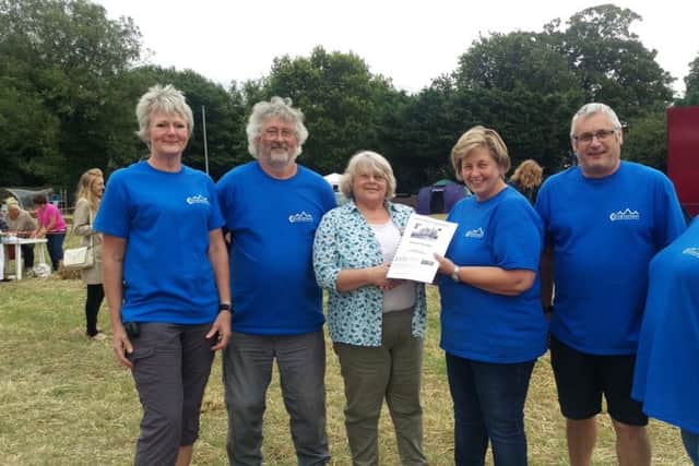 Covenham Plough Community Hub members, alongside Marie Chapman, at the village fete on July 15.