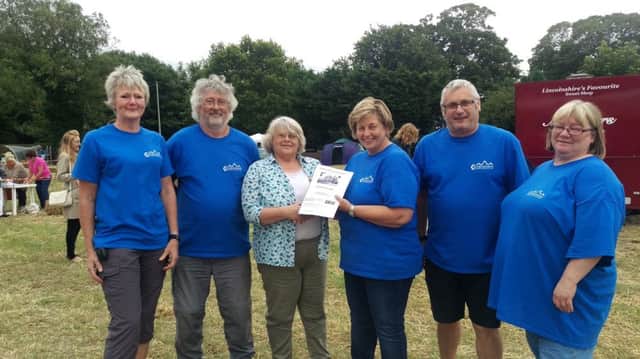 Covenham Plough Community Hub members, alongside Marie Chapman, at the village fete on July 15.