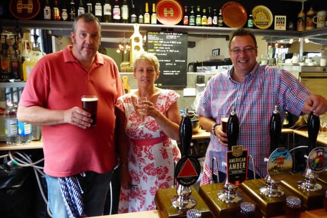 Cheers to this new business - Pictured is: Tony Howkins, Lisa Howkins and David Stamp.